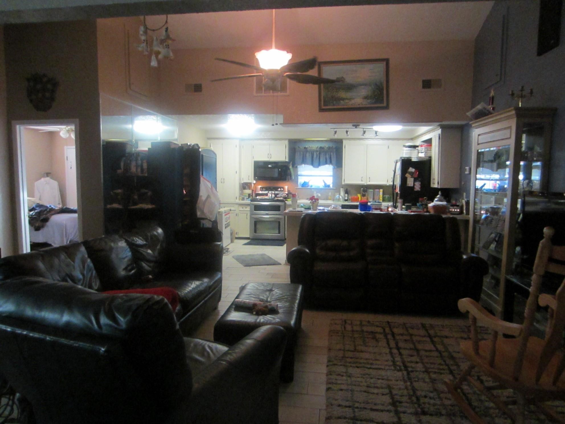 314 Shark Lane Surfside Beach, TX 77541 - Photo 12 of 12 a living room with furniture a flat screen tv and a fireplace