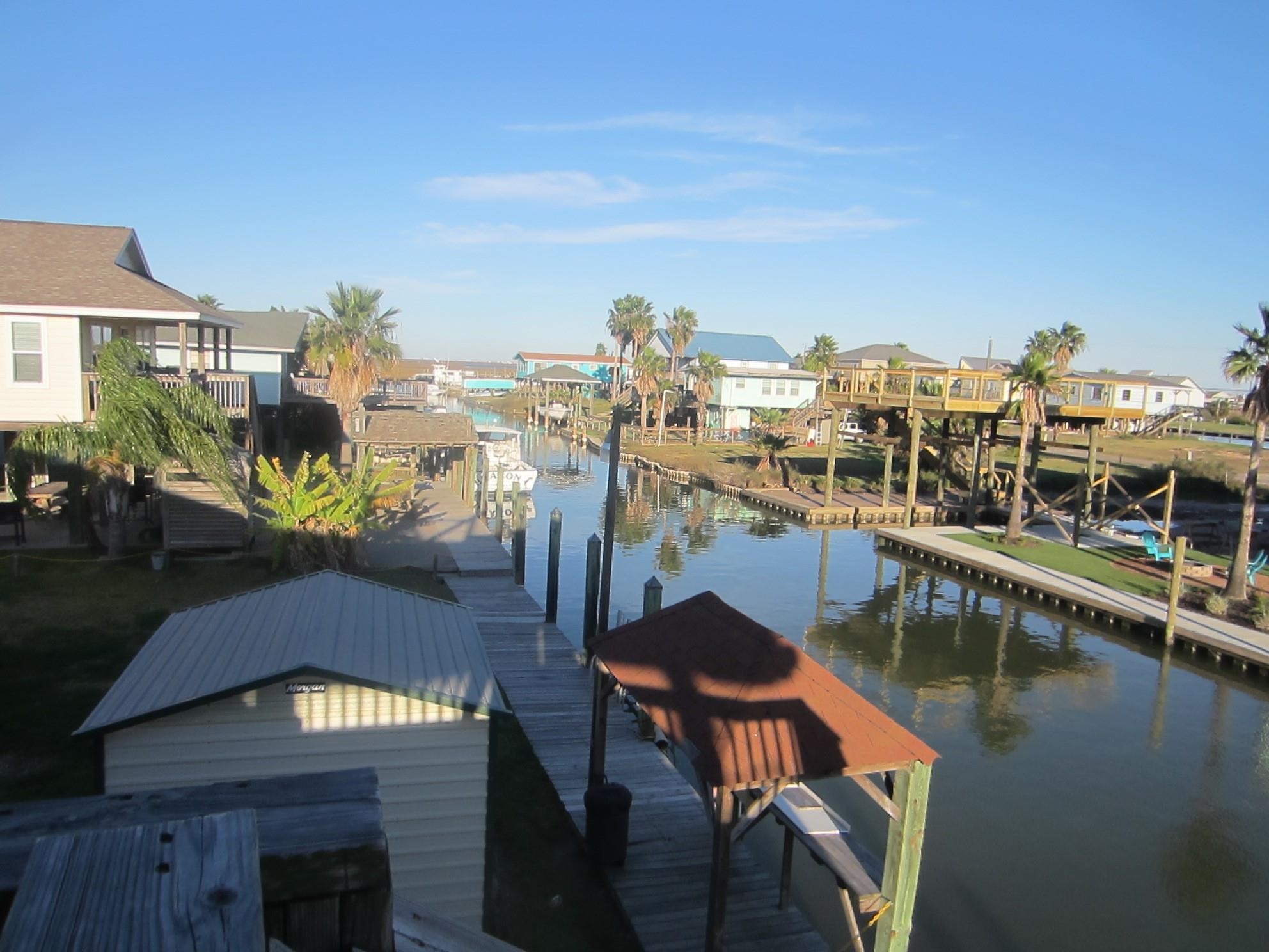 314 Shark Lane Surfside Beach, TX 77541 - Photo 2 of 12 a view of a lake from a balcony