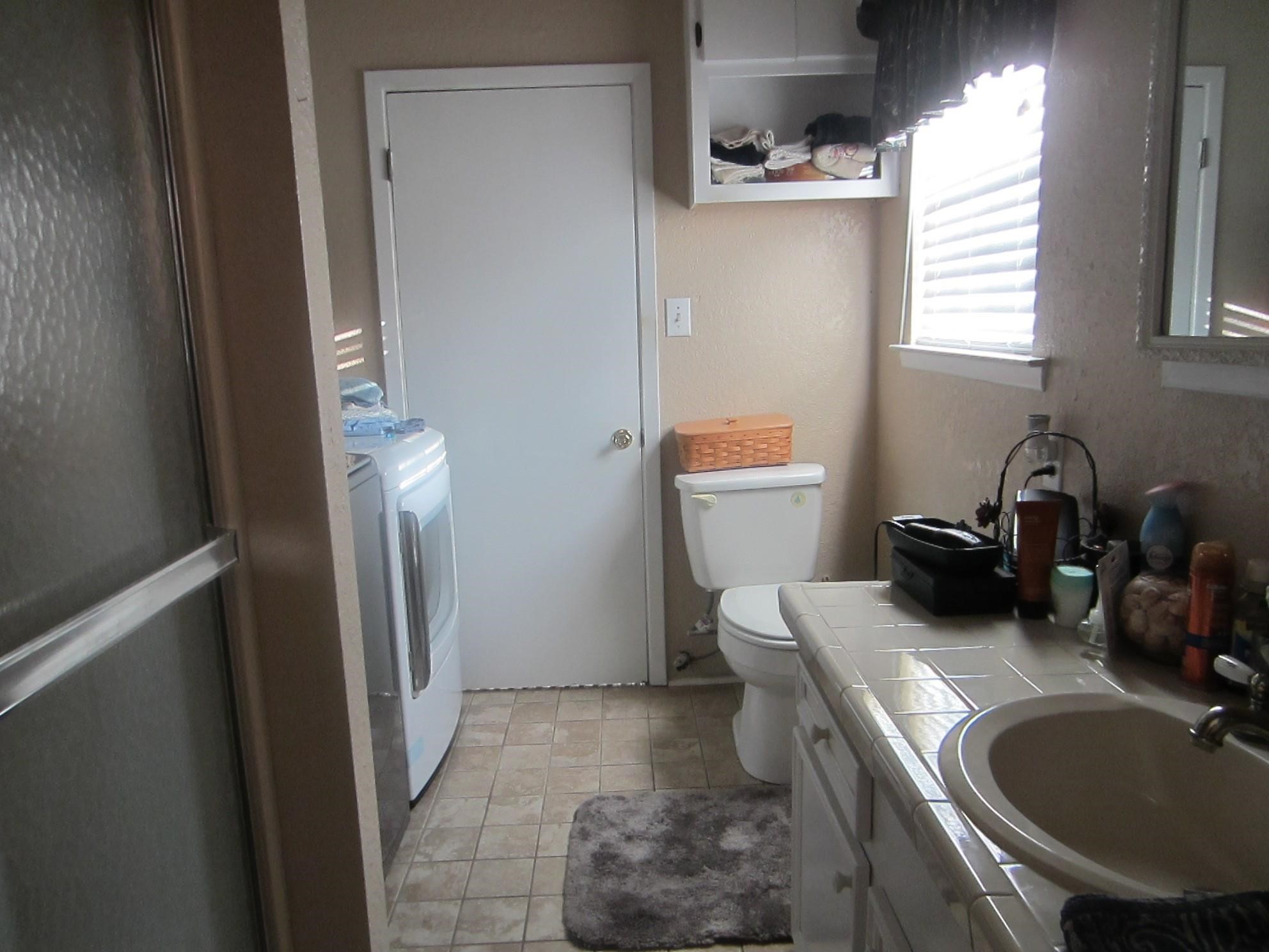 314 Shark Lane Surfside Beach, TX 77541 - Photo 5 of 12 a bathroom with a sink and a toilet