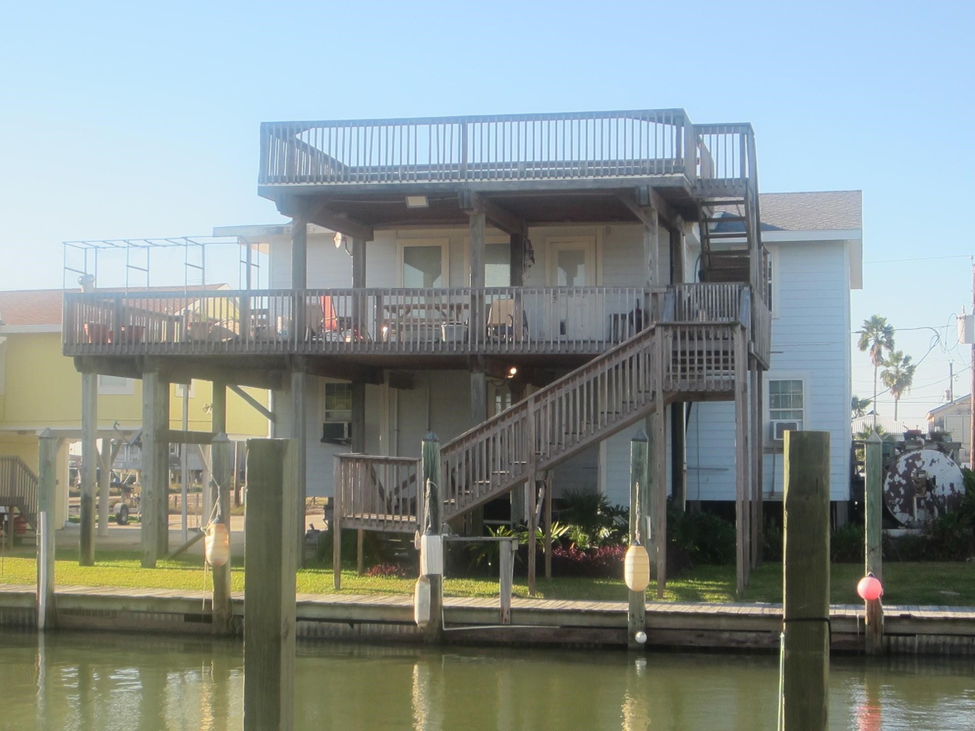 314 Shark Lane Surfside Beach, TX 77541 - Photo 7 of 12 a view of a swimming pool with a balcony