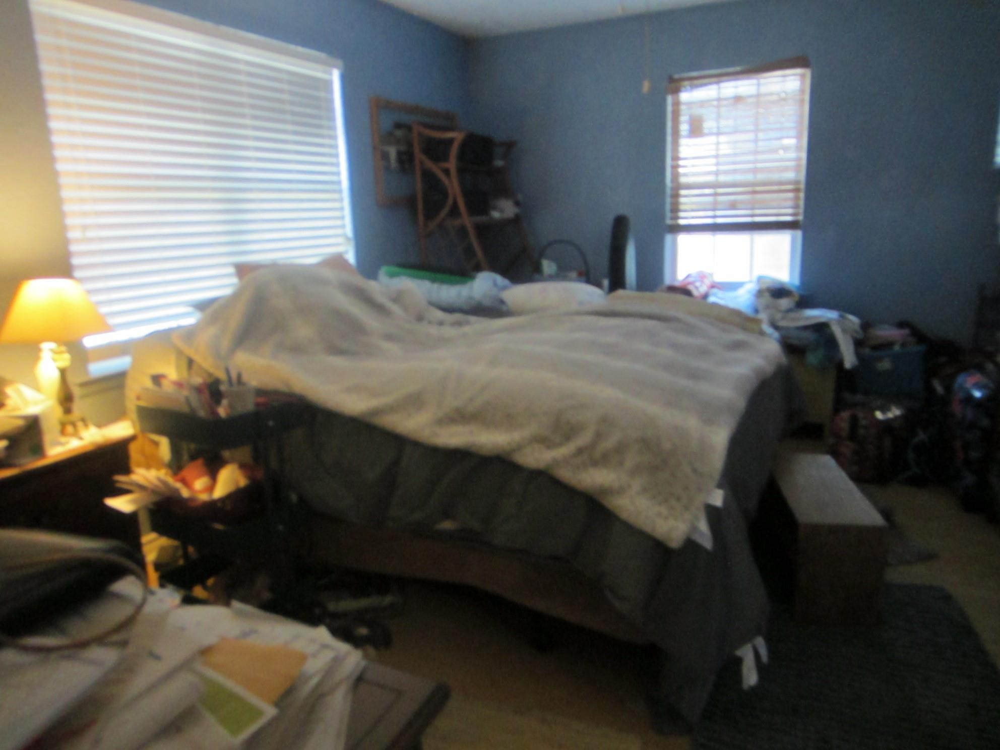 314 Shark Lane Surfside Beach, TX 77541 - Photo 9 of 12 a bedroom with a bed and a window