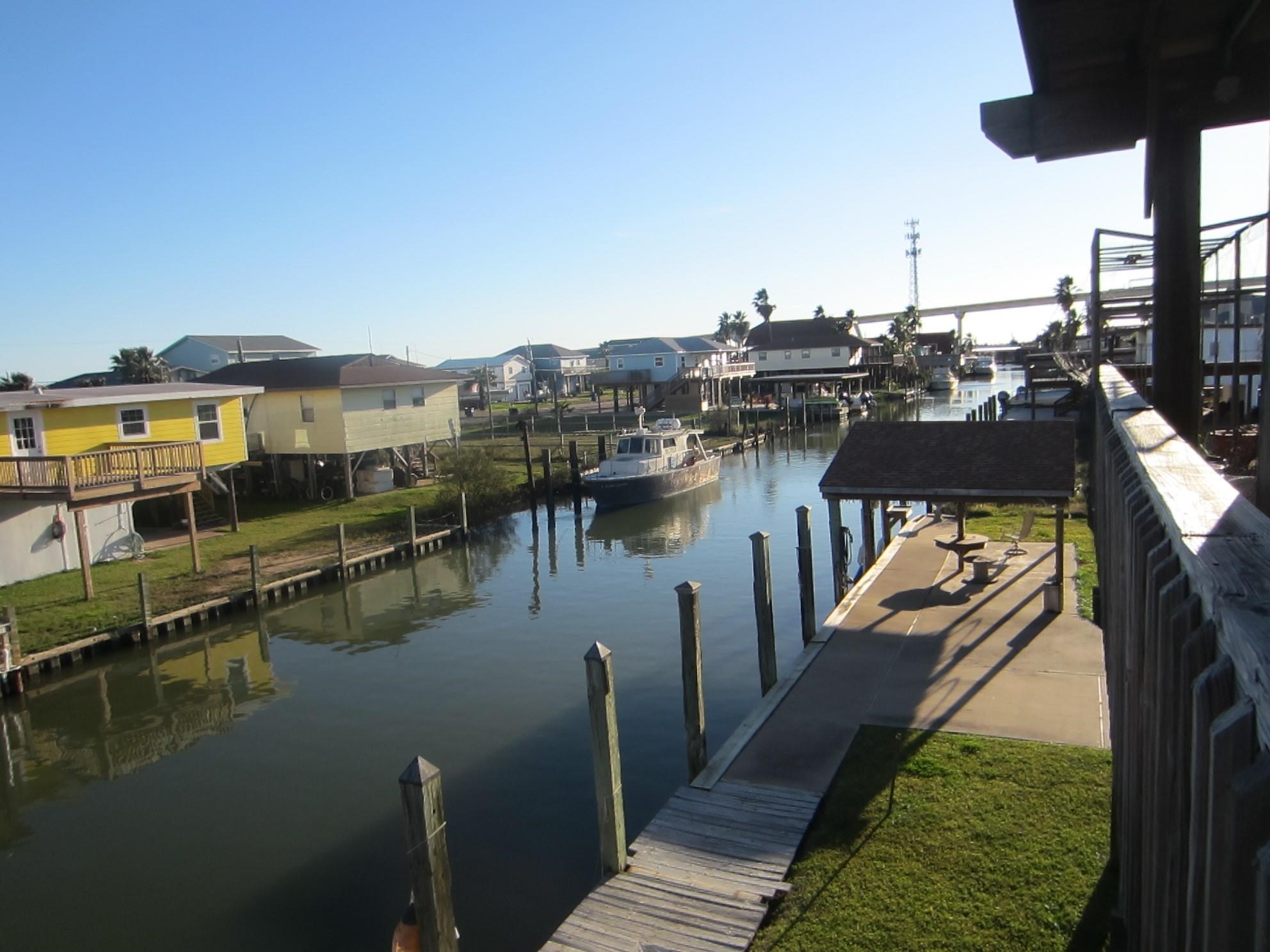 314 Shark Lane Surfside Beach, TX 77541 - Photo 10 of 12 a view of a lake with a ocean view