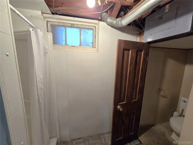 a view of a livingroom with furniture and a window