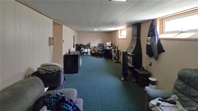 a view of a workspace with furniture and a livingroom