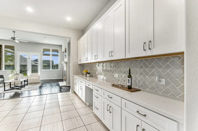 a kitchen with stainless steel appliances a sink and cabinets