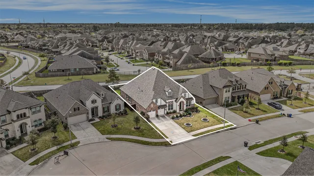 an aerial view of a house with a garden