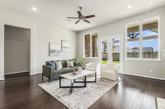 a living room with furniture and a window
