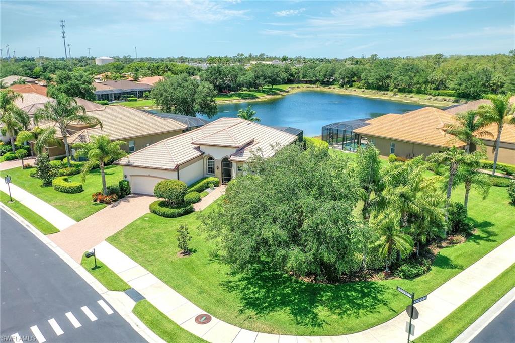 Undisclosed Address Naples, FL 34113 - Photo 4 of 30 an aerial view of a house with pool patio and outdoor seating