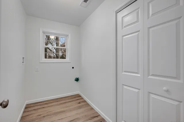 a view of a room that has a window in it