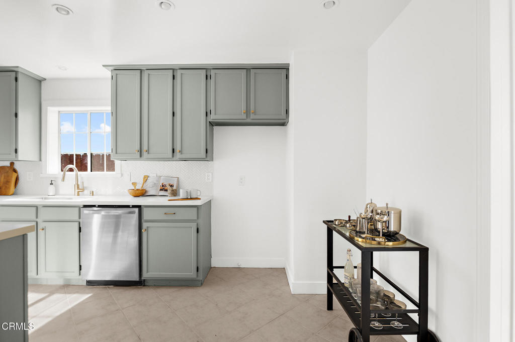 1010 Pepperhill Road Pasadena, CA 91107 - Photo 14 of 35 a kitchen with sink cabinets and window