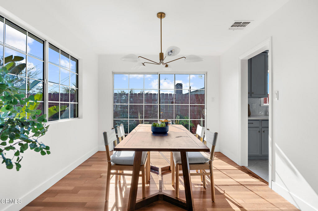 1010 Pepperhill Road Pasadena, CA 91107 - Photo 15 of 35 a table that has a table and a chair with wooden floor