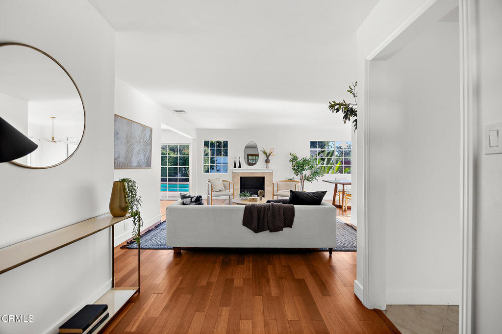 1010 Pepperhill Road Pasadena, CA 91107 - Photo 5 of 35 a living room with furniture a fireplace and wooden floor