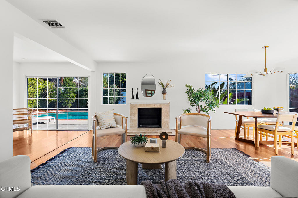 1010 Pepperhill Road Pasadena, CA 91107 - Photo 6 of 35 a living room with furniture a fireplace and a table