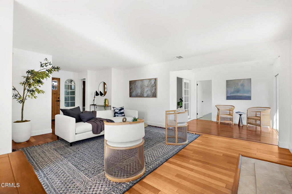1010 Pepperhill Road Pasadena, CA 91107 - Photo 9 of 35 a living room with furniture a table and wooden floor