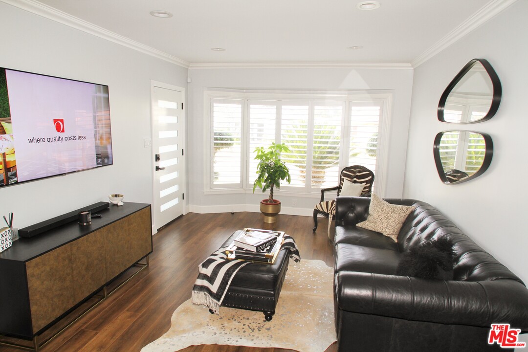 1712 West Poplar Street Compton, CA 90220 - Photo 2 of 41 a living room with furniture rug and window
