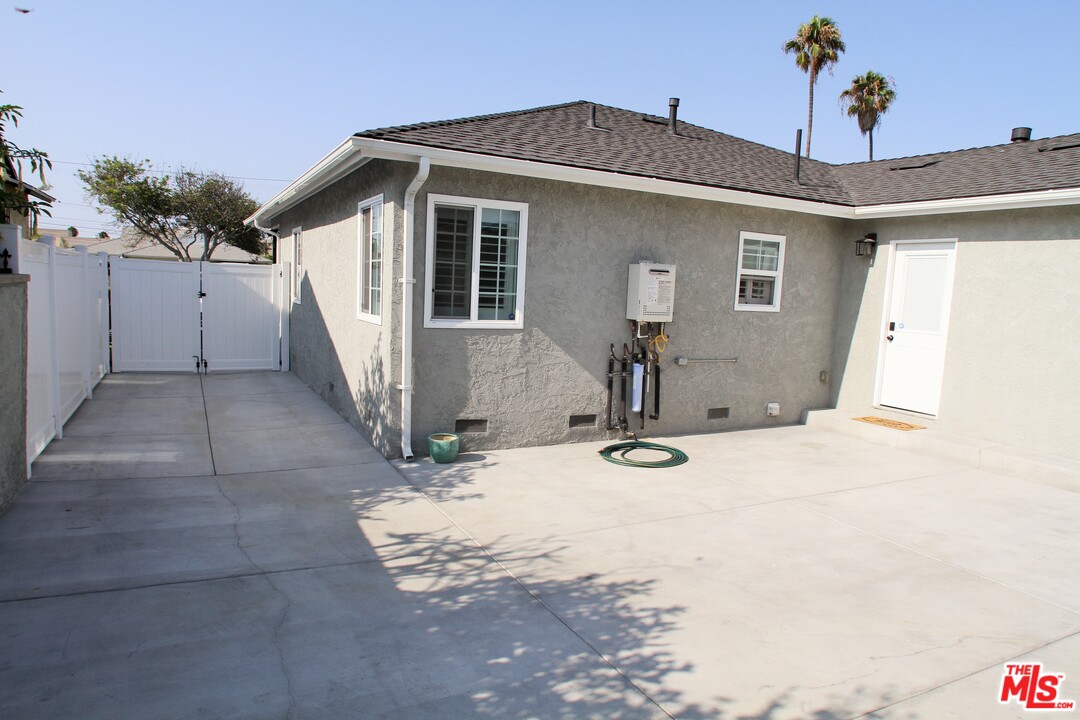 1712 West Poplar Street Compton, CA 90220 - Photo 31 of 41 a view of a house with snow on the road