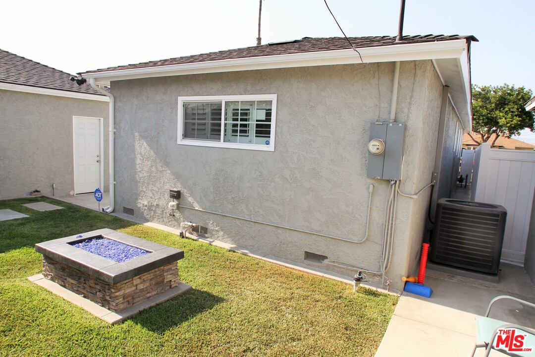 1712 West Poplar Street Compton, CA 90220 - Photo 34 of 41 a front view of a house with a yard