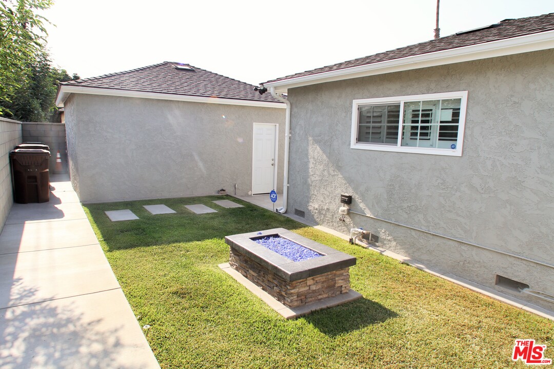 1712 West Poplar Street Compton, CA 90220 - Photo 35 of 41 a front view of a house with yard