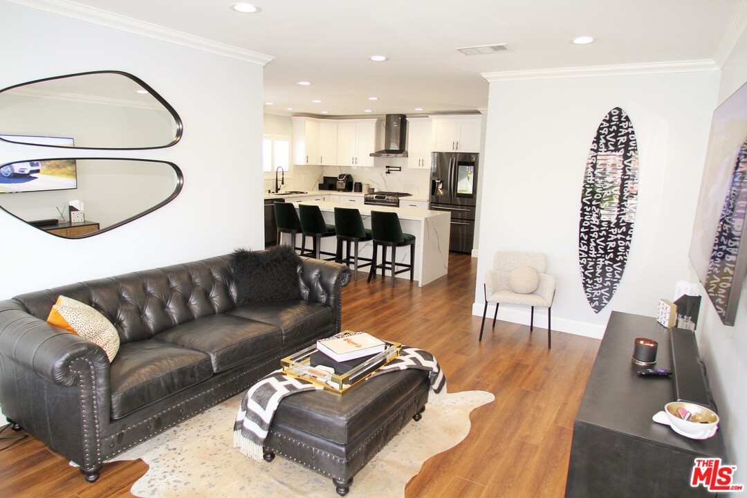 1712 West Poplar Street Compton, CA 90220 - Photo 5 of 41 a living room with furniture and a wooden floor