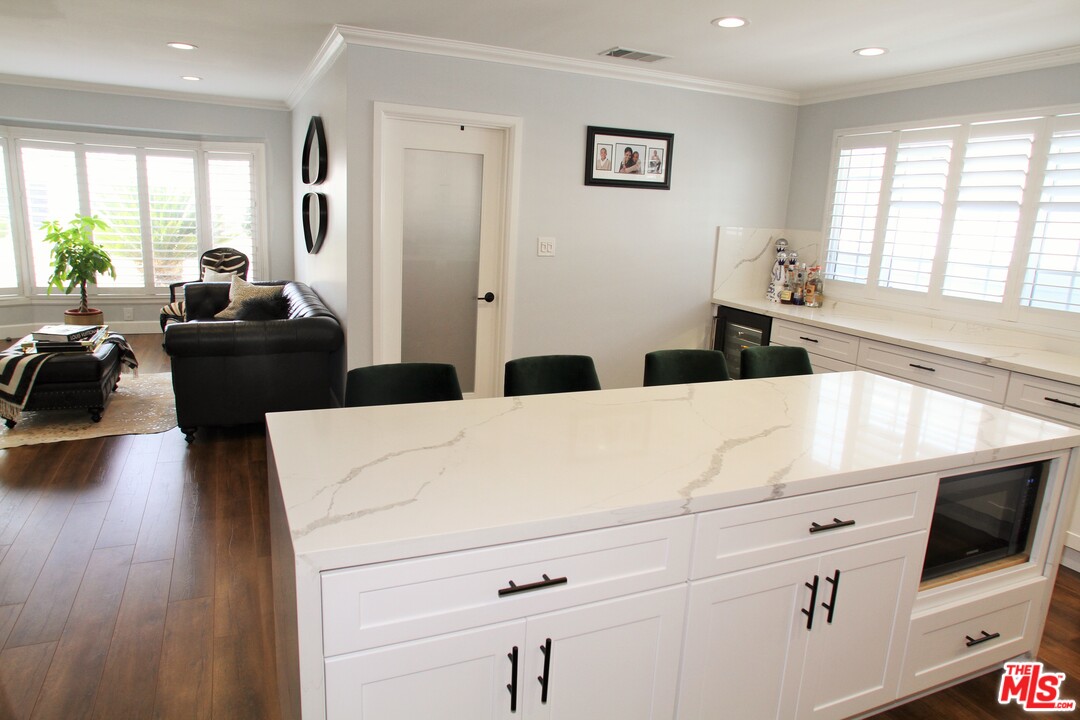 1712 West Poplar Street Compton, CA 90220 - Photo 6 of 41 a living room with furniture and a large window