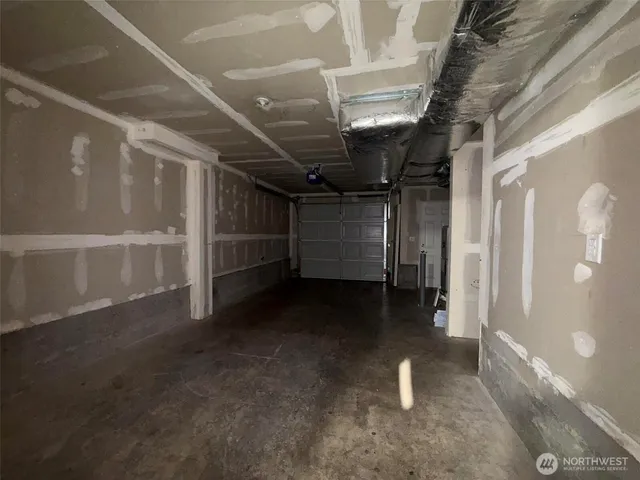 a kitchen with a refrigerator a stove top oven a sink and a potted plant