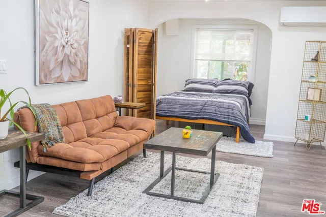 a living room with a couch and a window