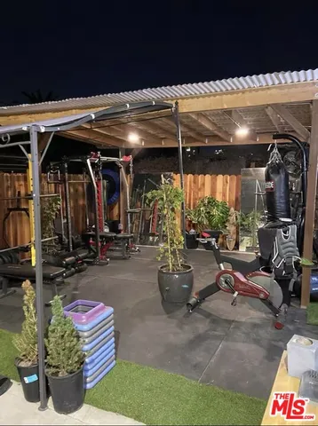 a view of gym room with gym equipment