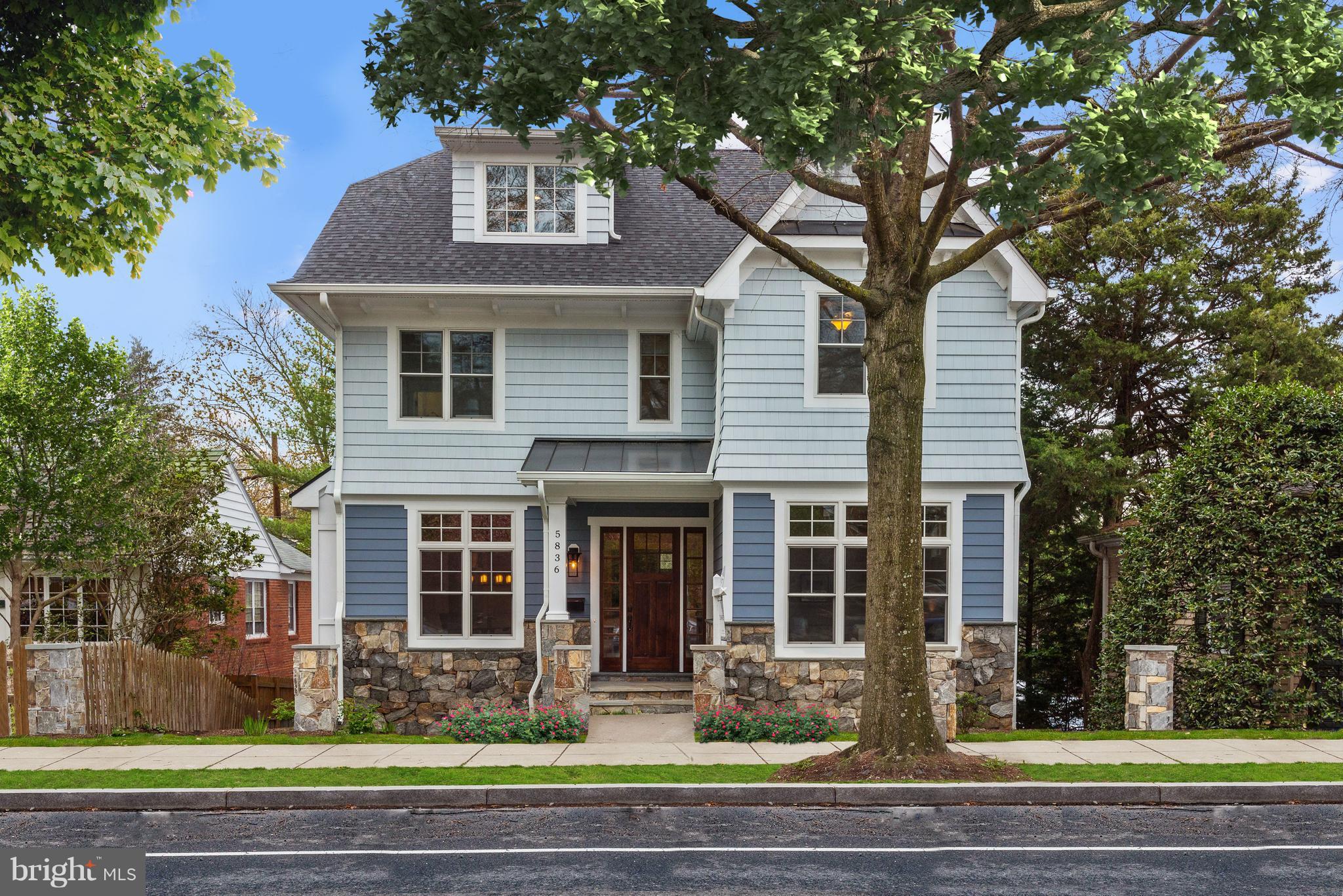 5836 MacArthur Boulevard Northwest Washington, DC 20016 - Photo 1 of 29 a front view of a house with garage