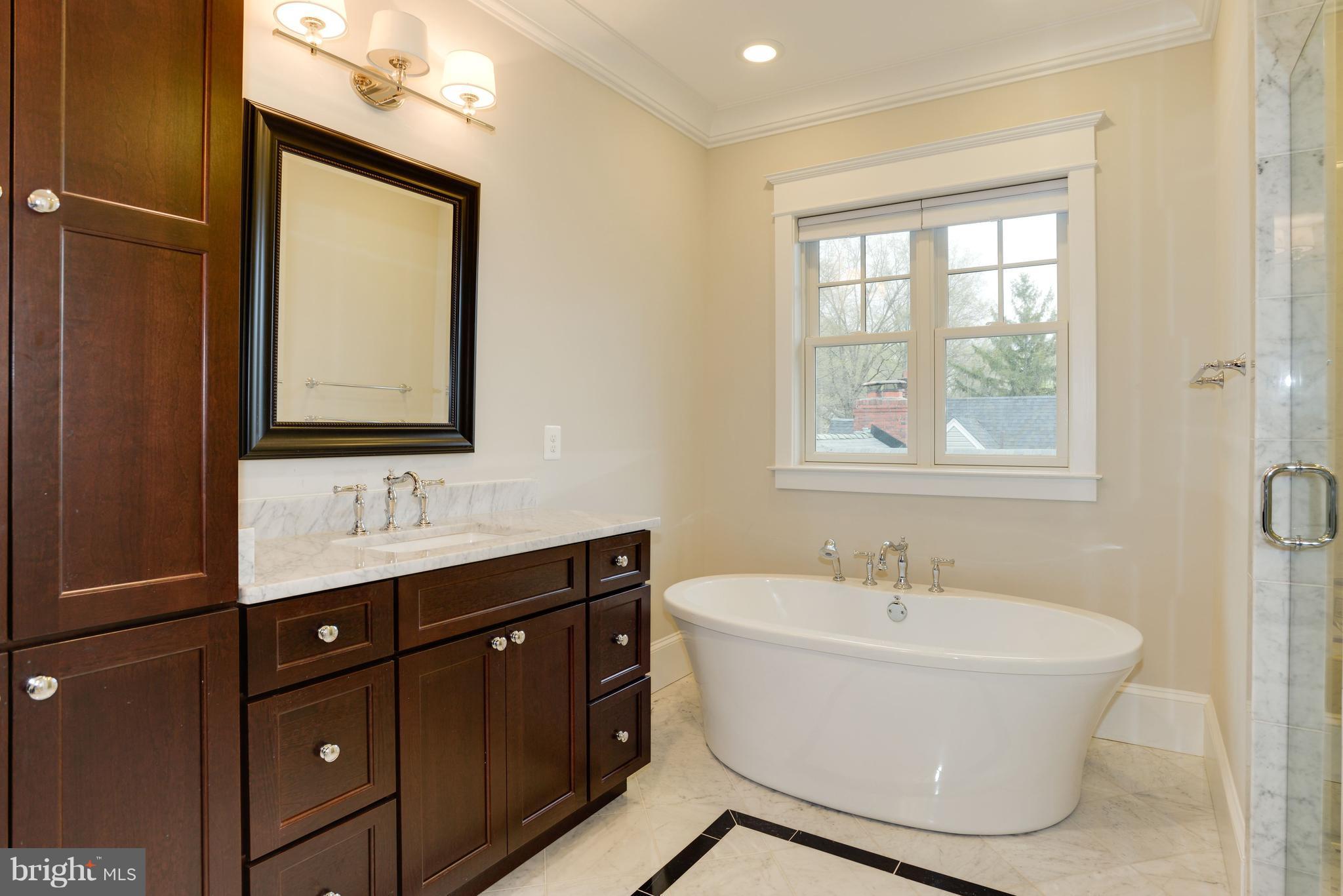 5836 MacArthur Boulevard Northwest Washington, DC 20016 - Photo 11 of 29 a bathroom with a bathtub and a sink