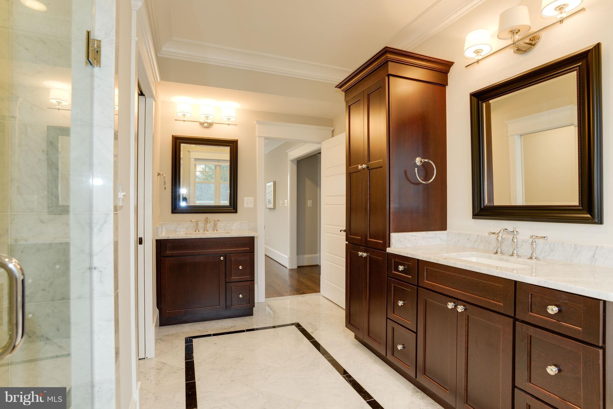 5836 MacArthur Boulevard Northwest Washington, DC 20016 - Photo 12 of 29 a spacious bathroom with a double vanity sink and a mirror