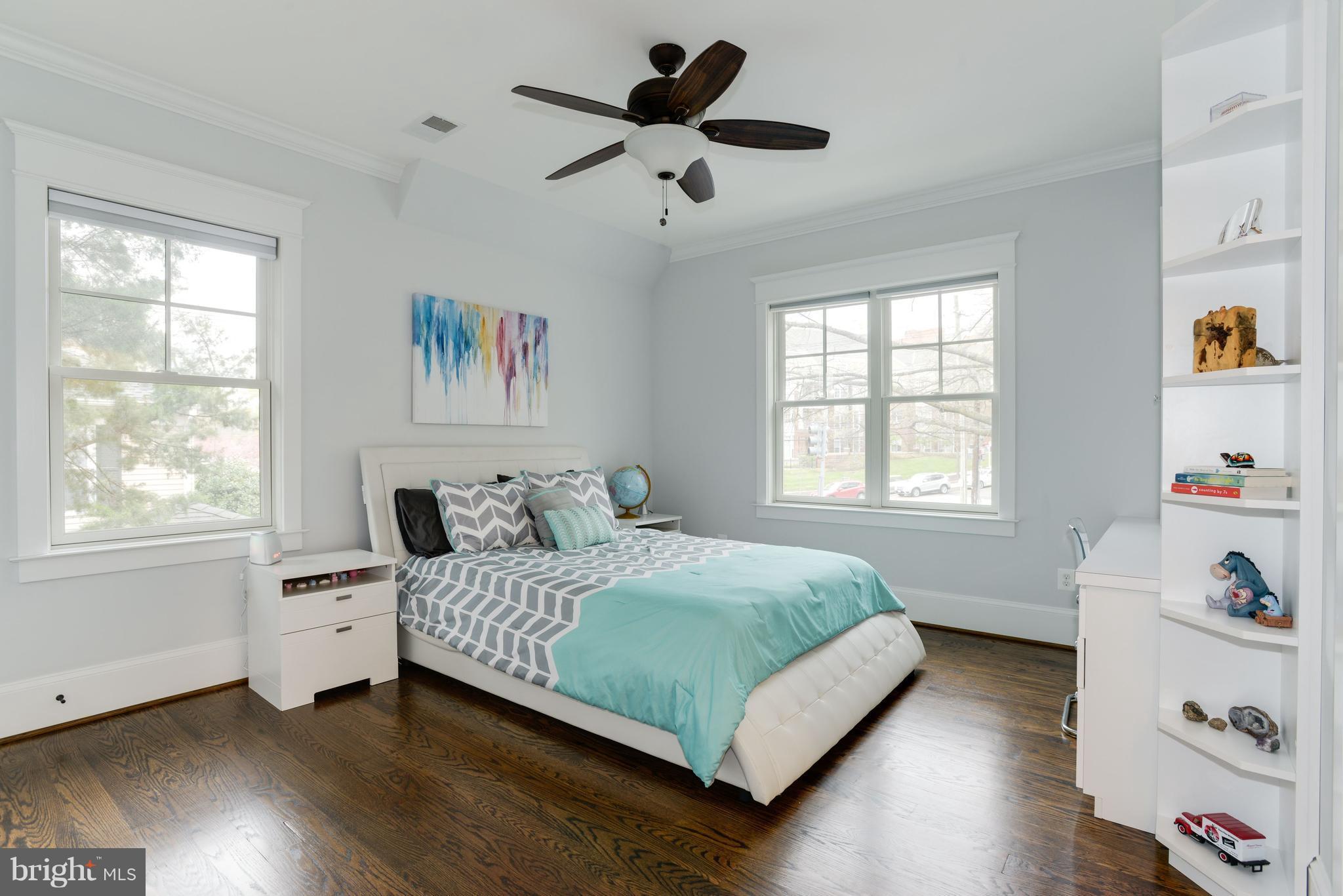 5836 MacArthur Boulevard Northwest Washington, DC 20016 - Photo 16 of 29 a bedroom with a bed and a window