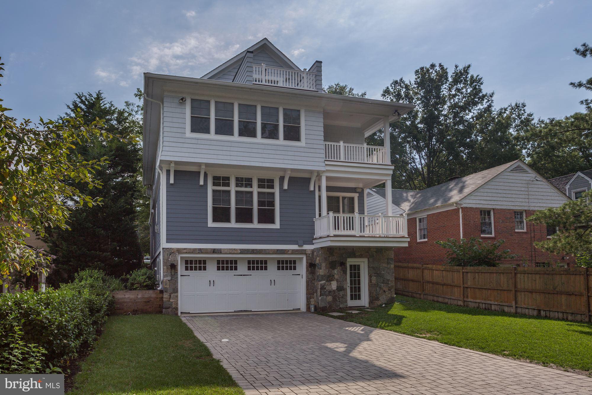 5836 MacArthur Boulevard Northwest Washington, DC 20016 - Photo 29 of 29 a front view of a house with a garden
