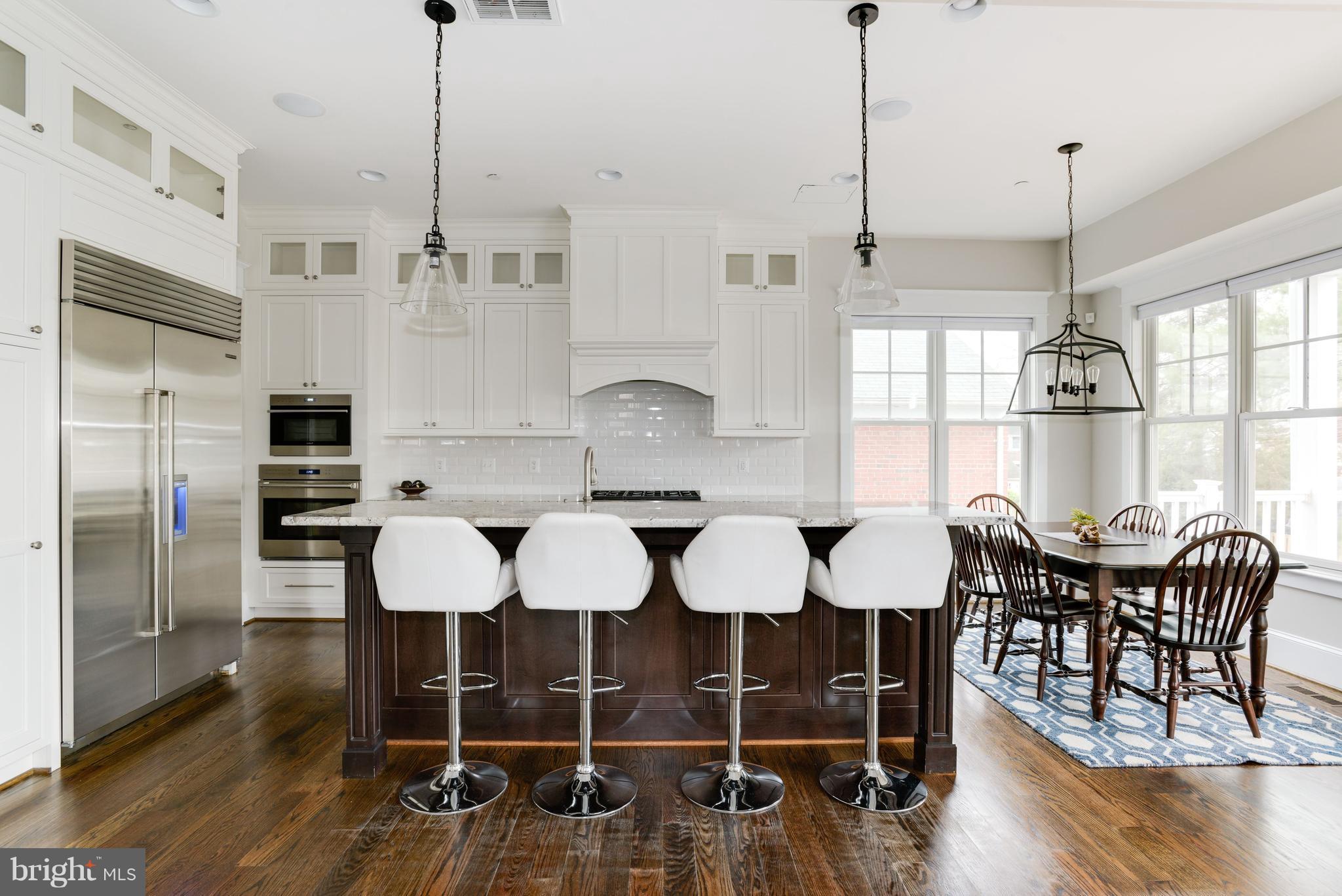 5836 MacArthur Boulevard Northwest Washington, DC 20016 - Photo 4 of 29 a view of a dining room with furniture window and wooden floor