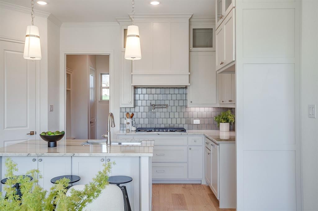 324 Slimp Bluff Azle, TX 76020 - Photo 14 of 35 a bathroom with a sink a faucet a potted plant and a mirror