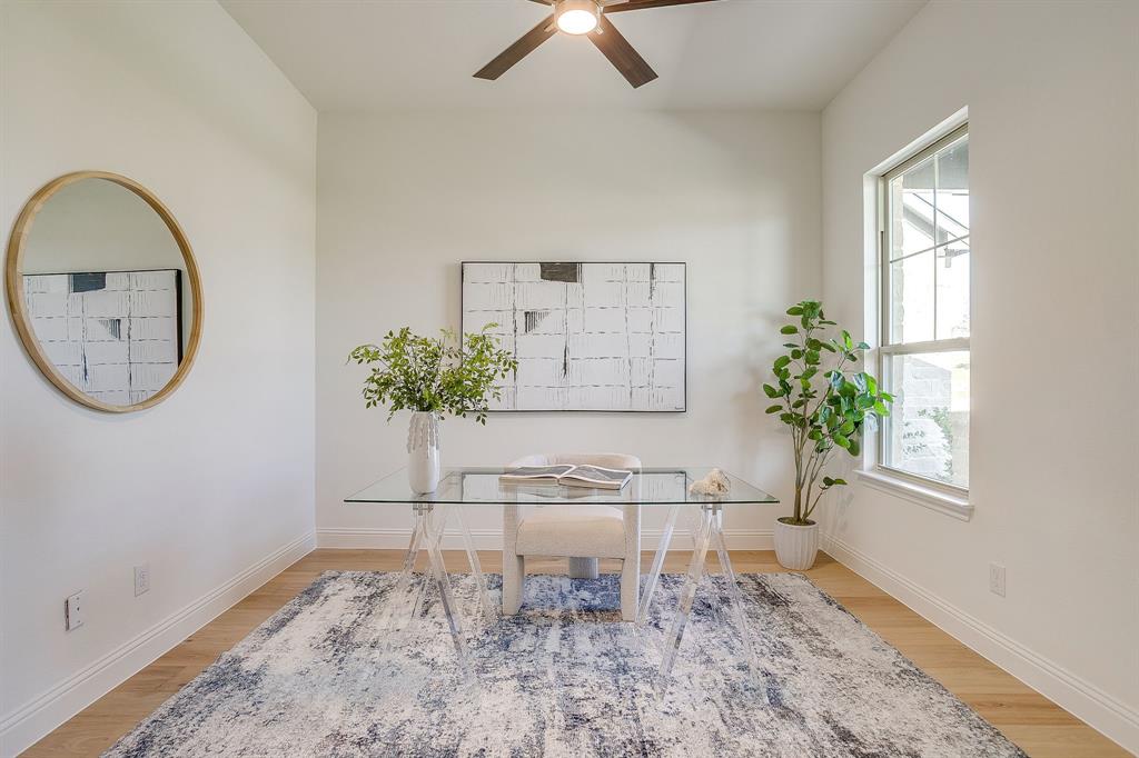 324 Slimp Bluff Azle, TX 76020 - Photo 15 of 35 a view of a hallway with a potted plant on a table and a window