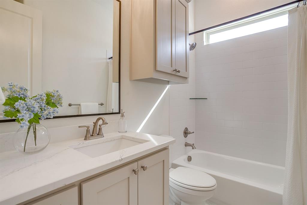 324 Slimp Bluff Azle, TX 76020 - Photo 24 of 35 a bathroom with a granite countertop sink a toilet and shower