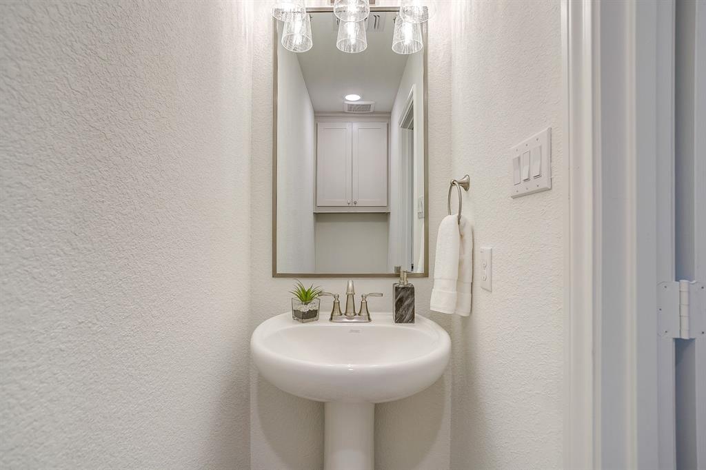 324 Slimp Bluff Azle, TX 76020 - Photo 28 of 35 a bathroom with a sink and a mirror