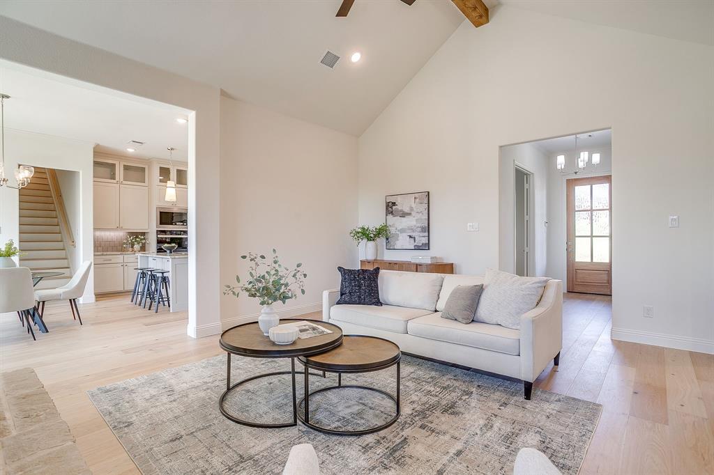 324 Slimp Bluff Azle, TX 76020 - Photo 7 of 35 a living room with furniture a rug and a table