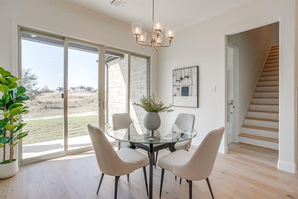 324 Slimp Bluff Azle, TX 76020 - Photo 8 of 35 a view of a dining room with furniture window and wooden floor