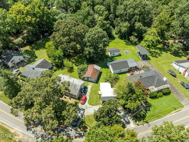an outdoor space with seating area and trees