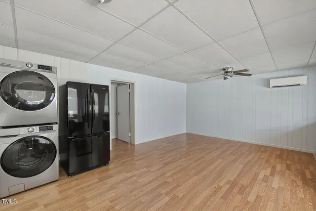 a view of a city with lush green forest