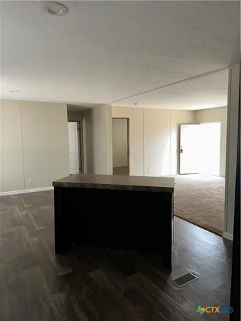 a living room with a table and a window