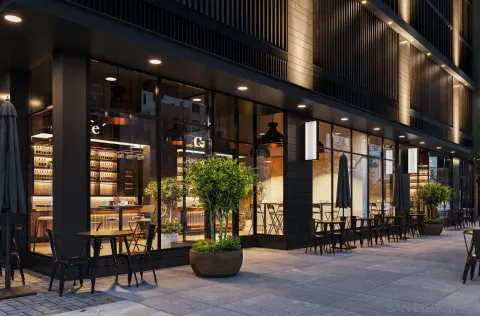 a building exterior with furniture and a large window