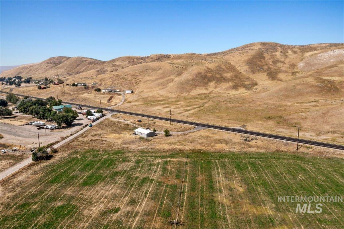 840 Highway 95 Weiser, ID 83672 - Photo 28 of 33 Aerial overview of property's location with rural landscape and a mountain backdrop