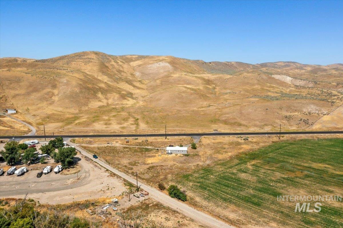 840 Highway 95 Weiser, ID 83672 - Photo 29 of 33 Aerial view of property's location with a mountainous background and rural landscape
