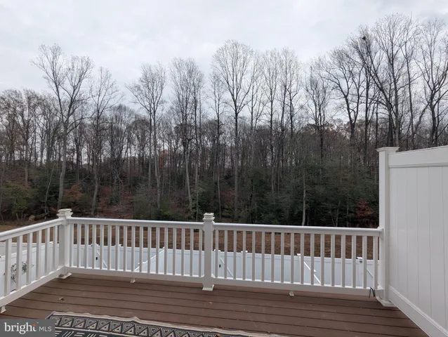 a view of balcony with furniture