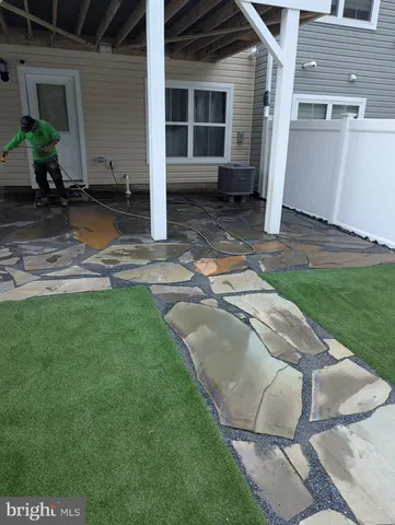 a view of a backyard with plants and lake view