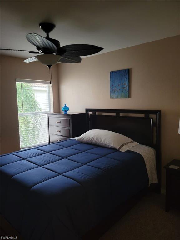 993 Hampton Circle, Unit 122 Naples, FL 34105 - Photo 17 of 26 a bedroom with a bed and a window