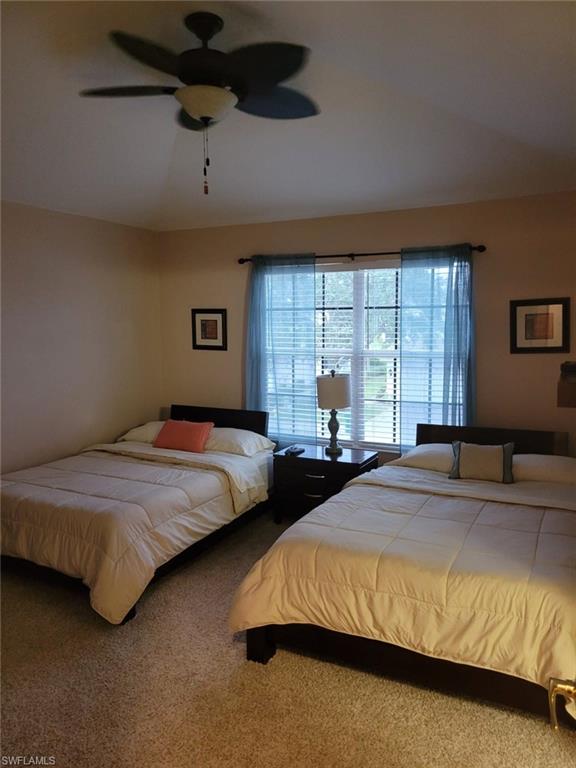 993 Hampton Circle, Unit 122 Naples, FL 34105 - Photo 21 of 26 a bedroom with a bed and window