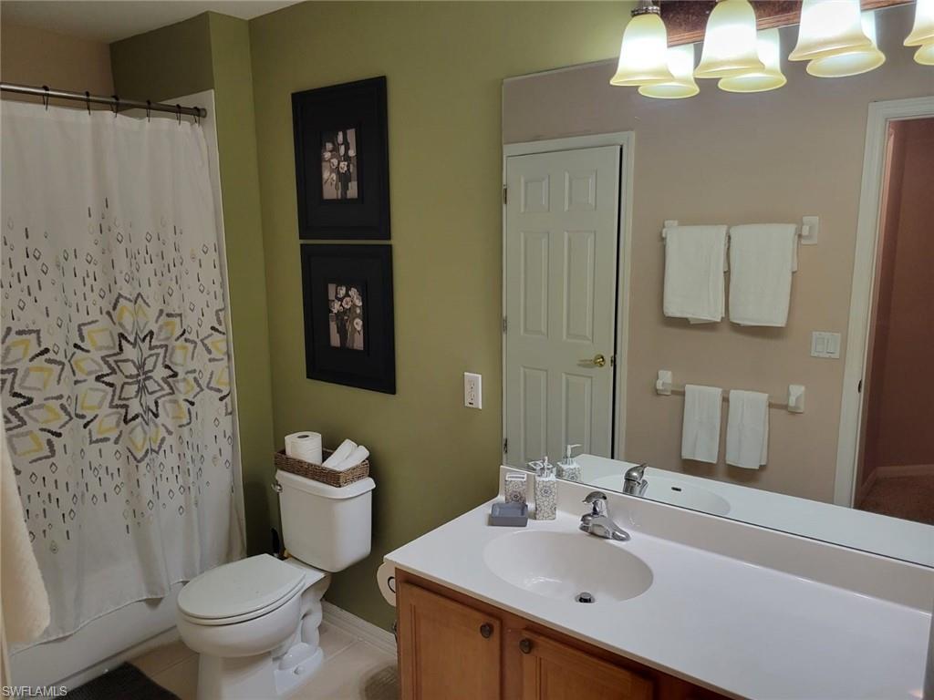 993 Hampton Circle, Unit 122 Naples, FL 34105 - Photo 22 of 26 a bathroom with a sink toilet and shower